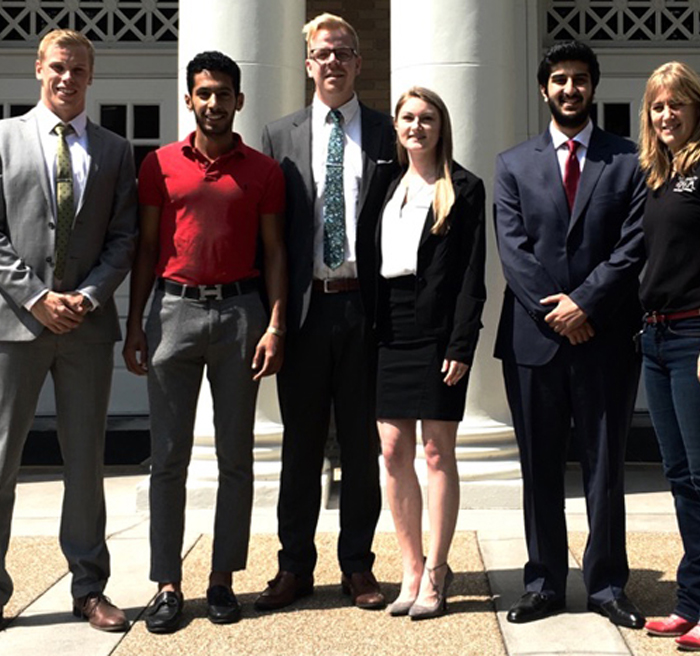 management students in front of Sykes COB 