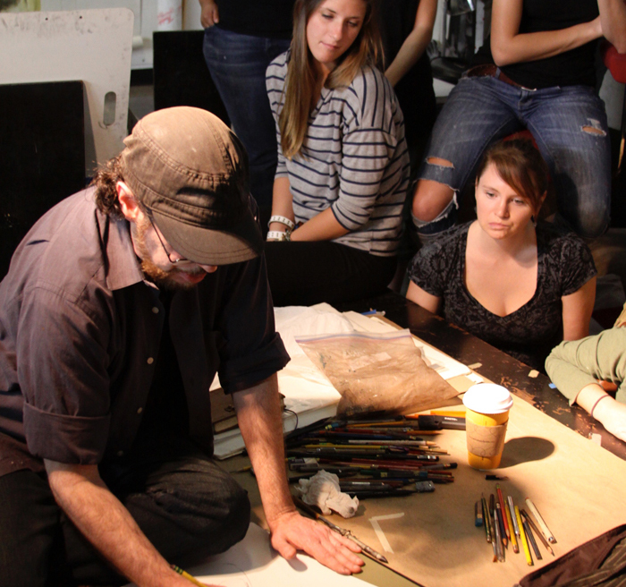 students watching artist 