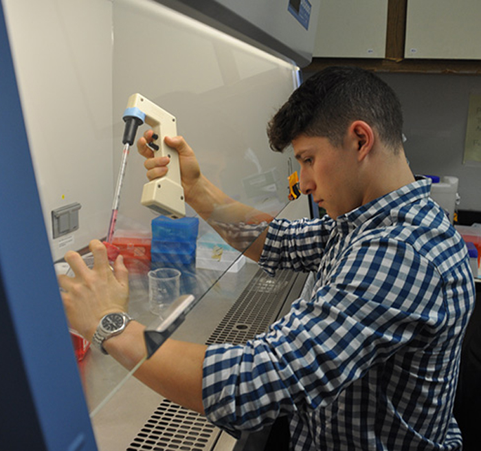 student doing an experiment 