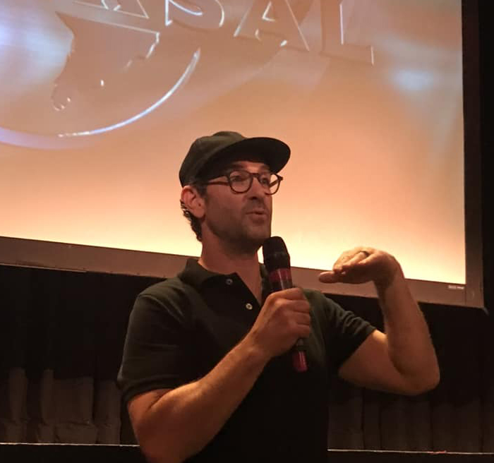 A man giving a presentation to a class