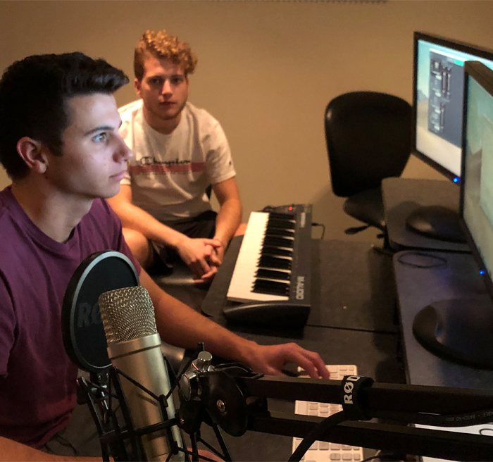 students working on editing on computer 