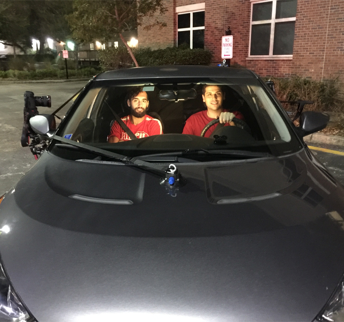 video camera on car with students in car 