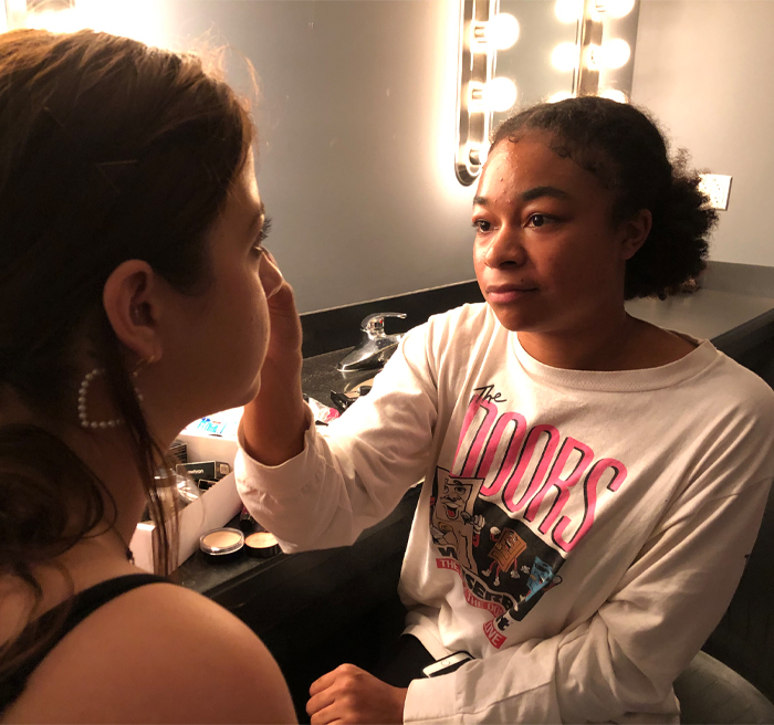 student doing other students makeup 