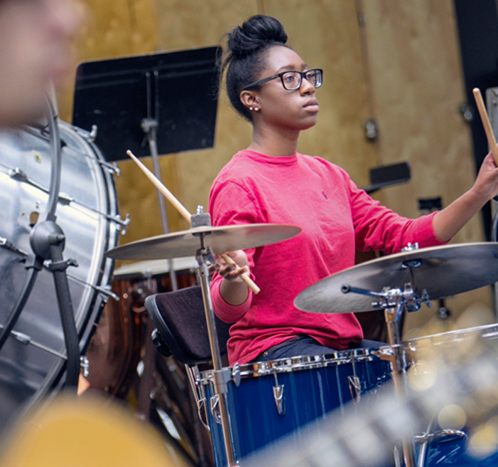 Student playing drums