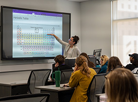 Professor teaching Periodic Table