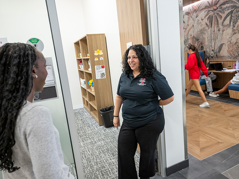 An academic advisor talks with a student.