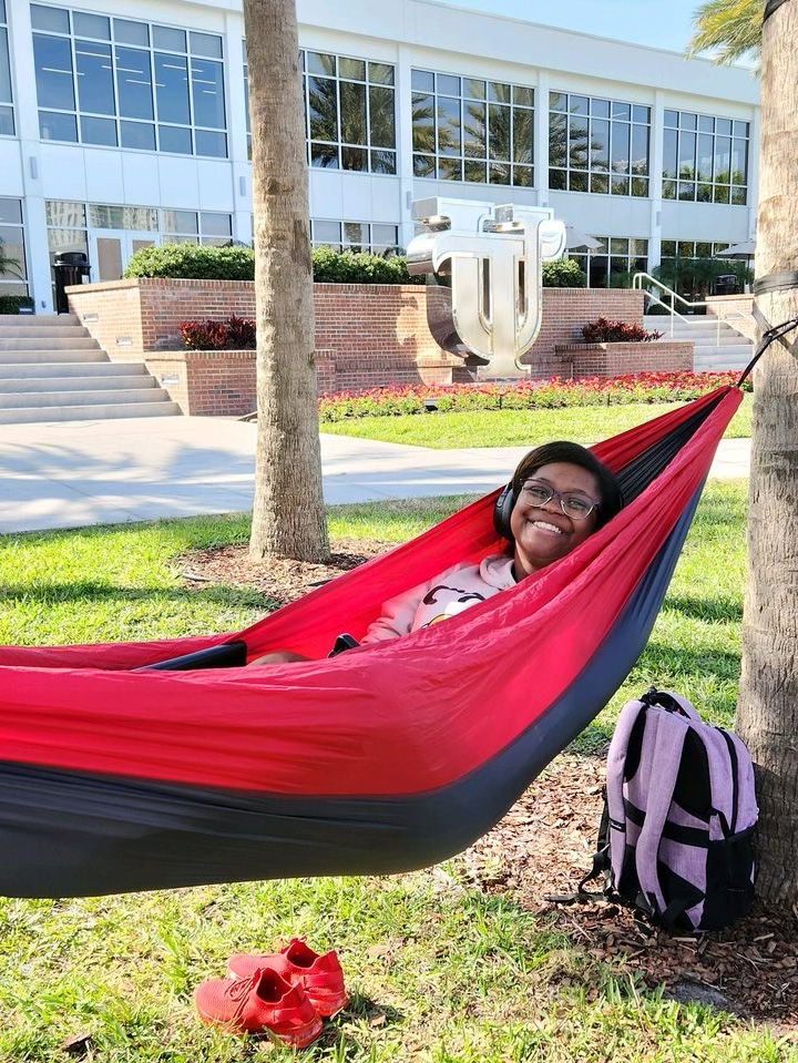 Student in hammock in Plant Park