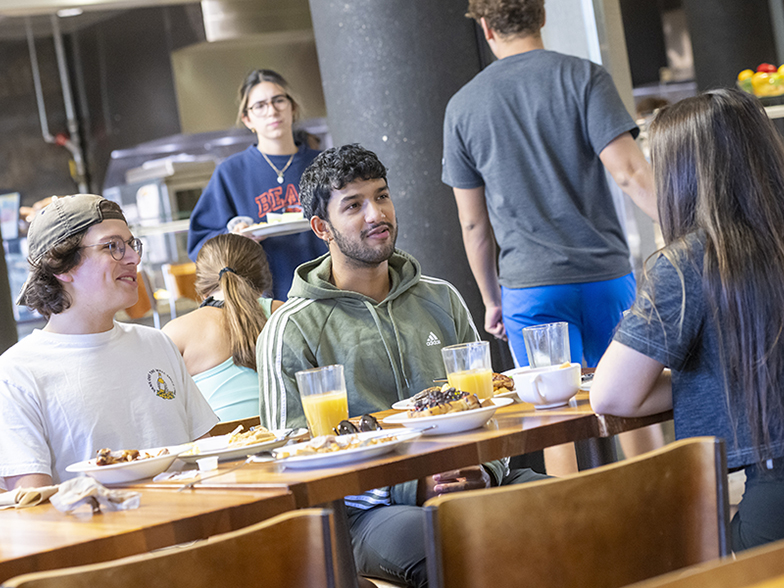 Students conversing over breakfast