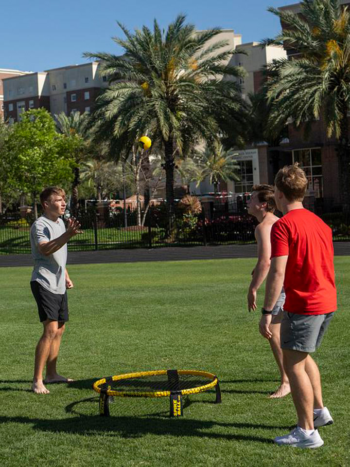 Students playing cornhole