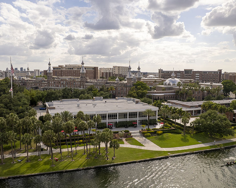Aerial view of campus by the river