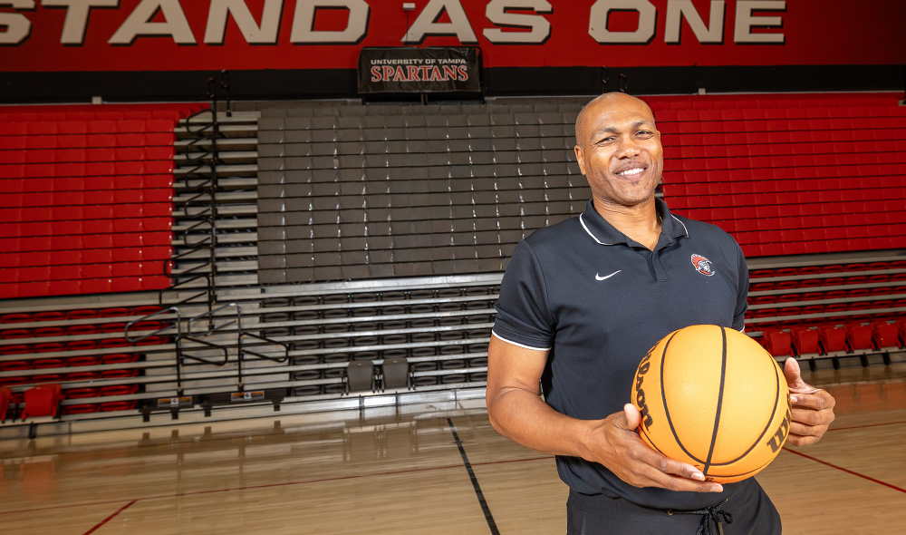 A man holds a basketball