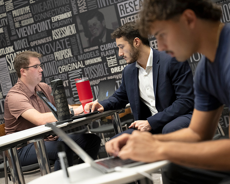Students working on their laptops in the Entrepreneurship Center.