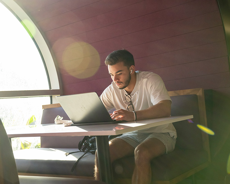 Student studying in the Grand Center.