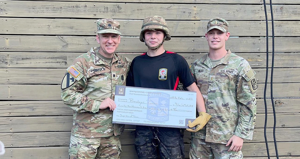 ROTC student receiving an award from his officers.